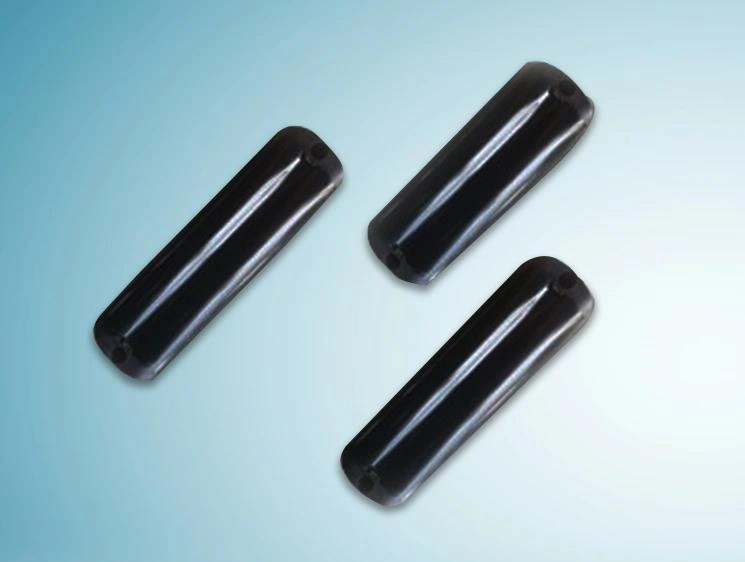 A trio of sleek, pill-shaped black IoT hardware units on a blue gradient background, representing Implementation Highlights for Iot Asset Tracking Device by Digital Dividend.