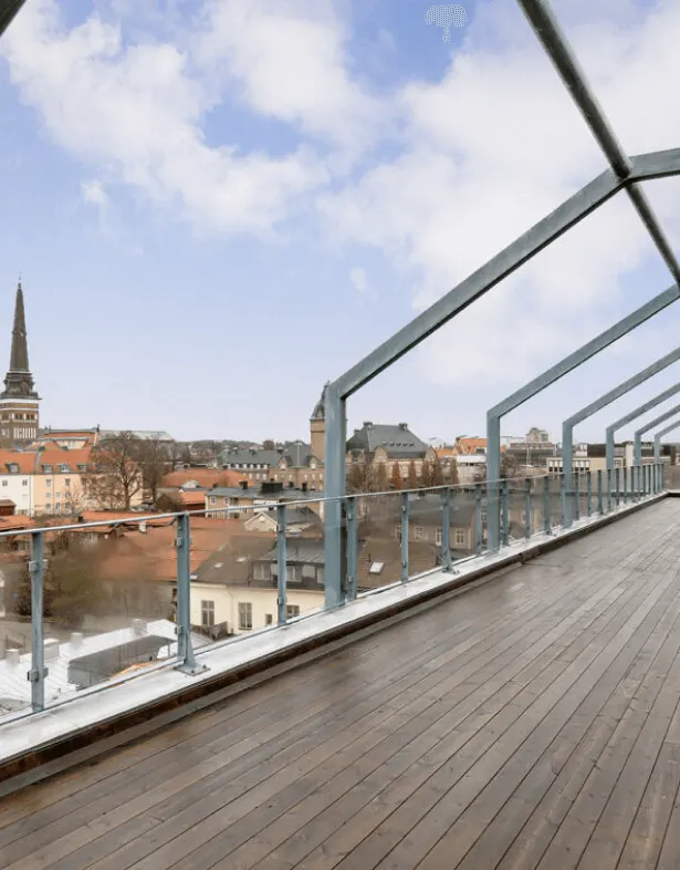An expansive rooftop view of a city skyline with a church spire, representing the "big picture" vision and the professional environment of Digital Dividend.